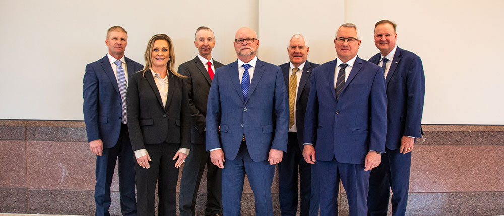 Group of people in business suits posing inside Minneapolis Convention Center